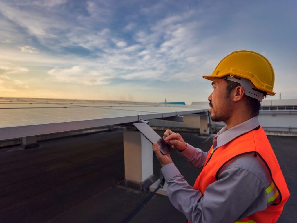 A roof inspector inspect the commercial roof in New York City