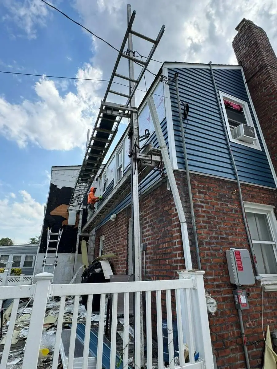 Contractor was doing siding repair New York City